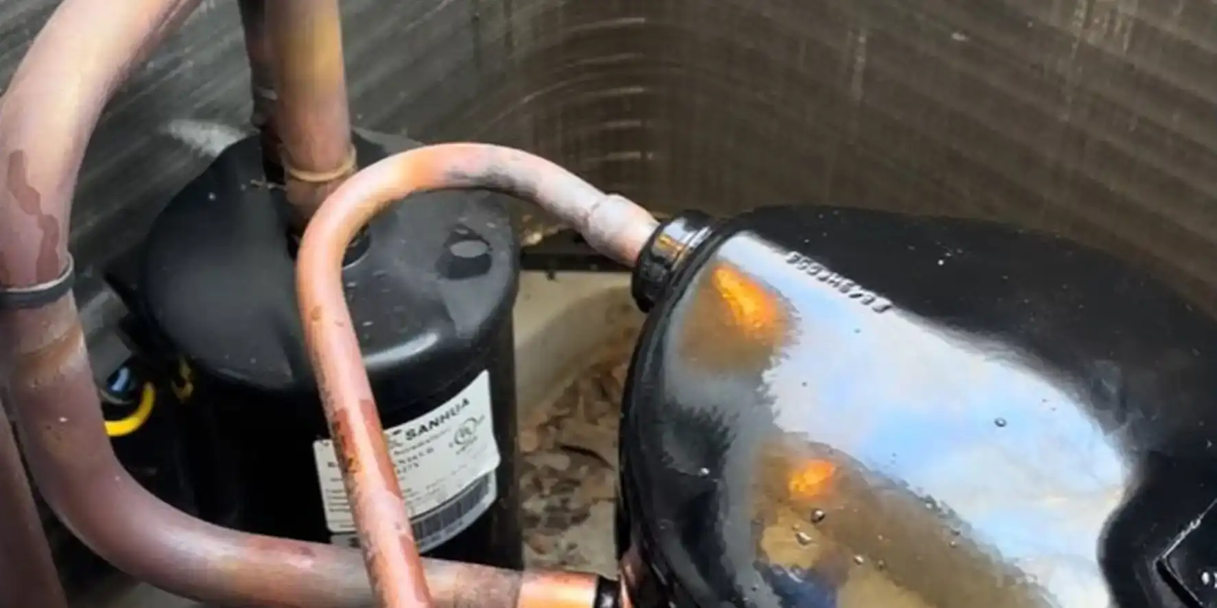 New scroll compressor brazed into a condenser cabinet beside the accumulator during a Liberty Air and Electric compressor replacement.