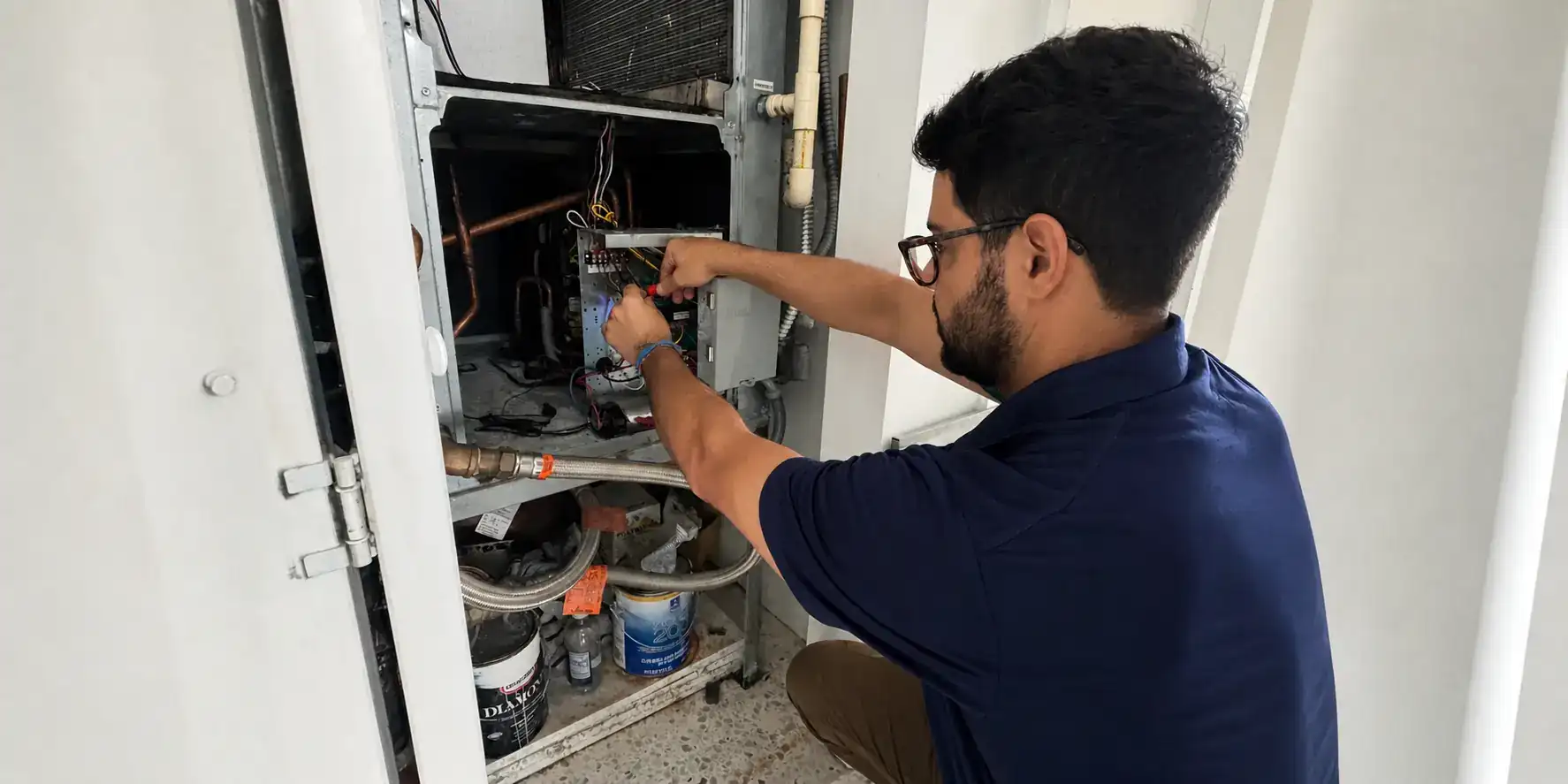 Liberty Air and Electric tech working on an air handler in a South Florida home.