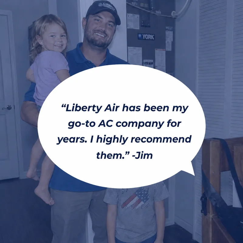Liberty Air and Electric customer Jim holding his young daughter near his home AC system, with his son standing next to him.